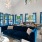 big blue couch with well lit clubroom