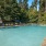 large swimming pool and poolside lounge chairs