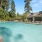 umbrella shaded tables and chairs poolside