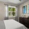 bedroom with bed and wall art