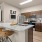 c-shaped kitchen with open counter seating looking into the living room
