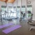 spacious fitness center with ample, natural lighting